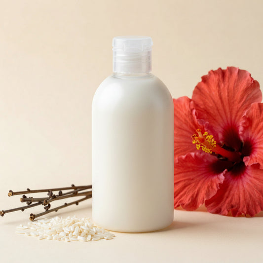Round Bottle of cream or lotion with a pink flower and twigs on a beige background